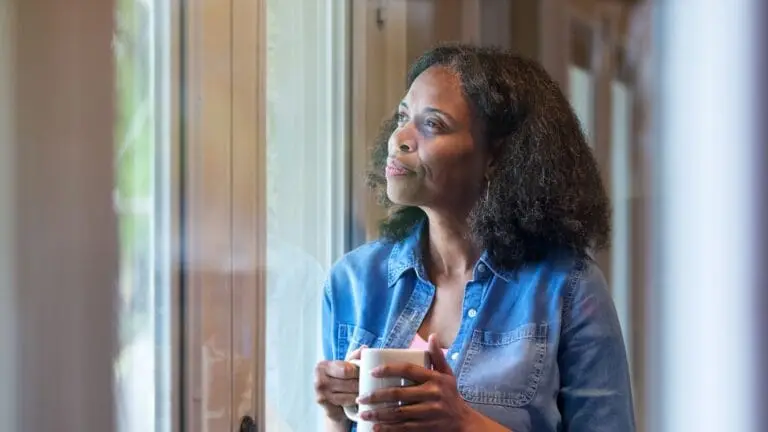 a woman thinking about her drinking habits